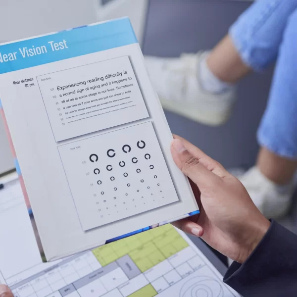 optometry-consulting-and-hand-with-a-vision-test-2023-11-27-05-13-13-utc